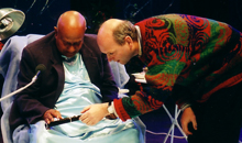 Martin Doyle presents spiritual teacher Sri Chinmoy with a three key flute on the stage of the Royal Albert Hall.
