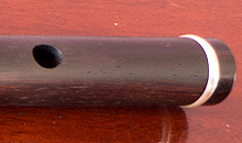 A Martin Doyle left handed six key flute made from Rosewood.