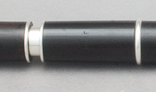 A thin-walled sterling silver tuning slide set in a Martin Doyle traditional style keyless flute made of African Blackwood.