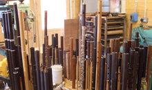 A wide variety of flutes and flute parts stand, like soldiers at attention, in Martin Doyle's workshop.