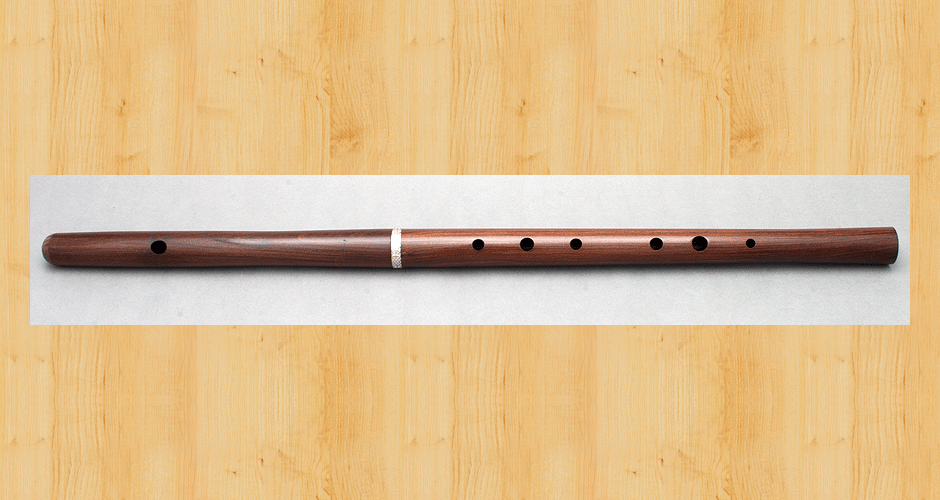 A Martin Doyle Celtic style D flute made from cocus wood with a sterling silver ferrule.